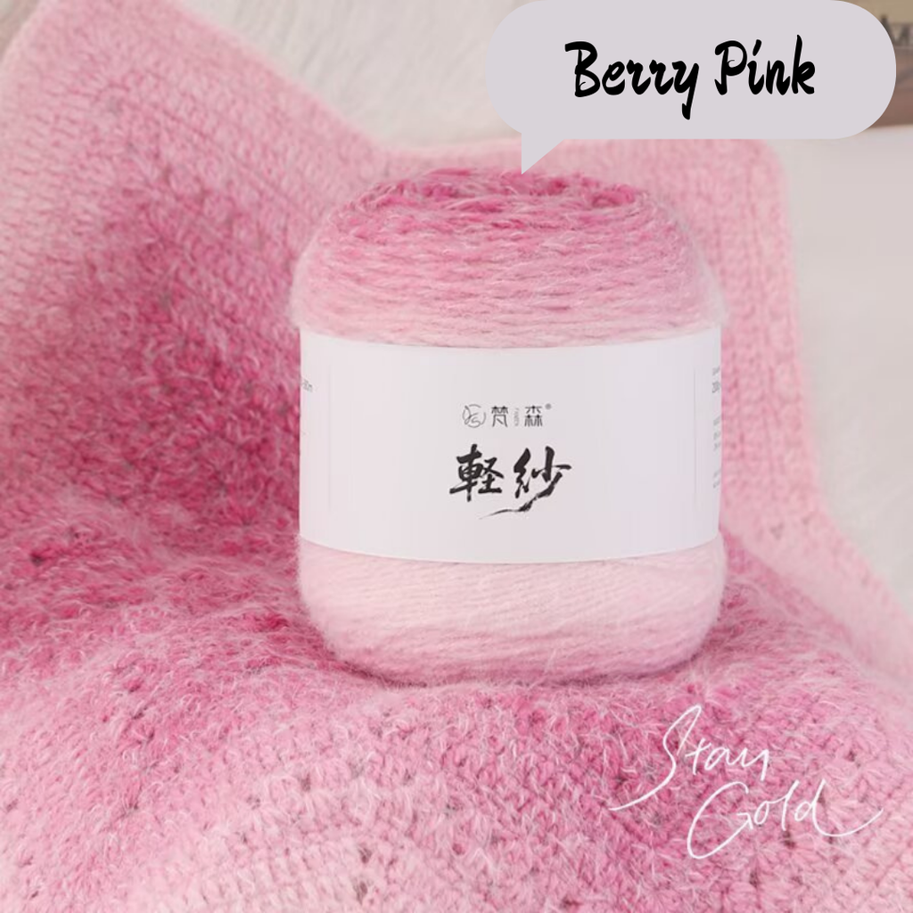 Ball of yarn with a label on a pink textured background