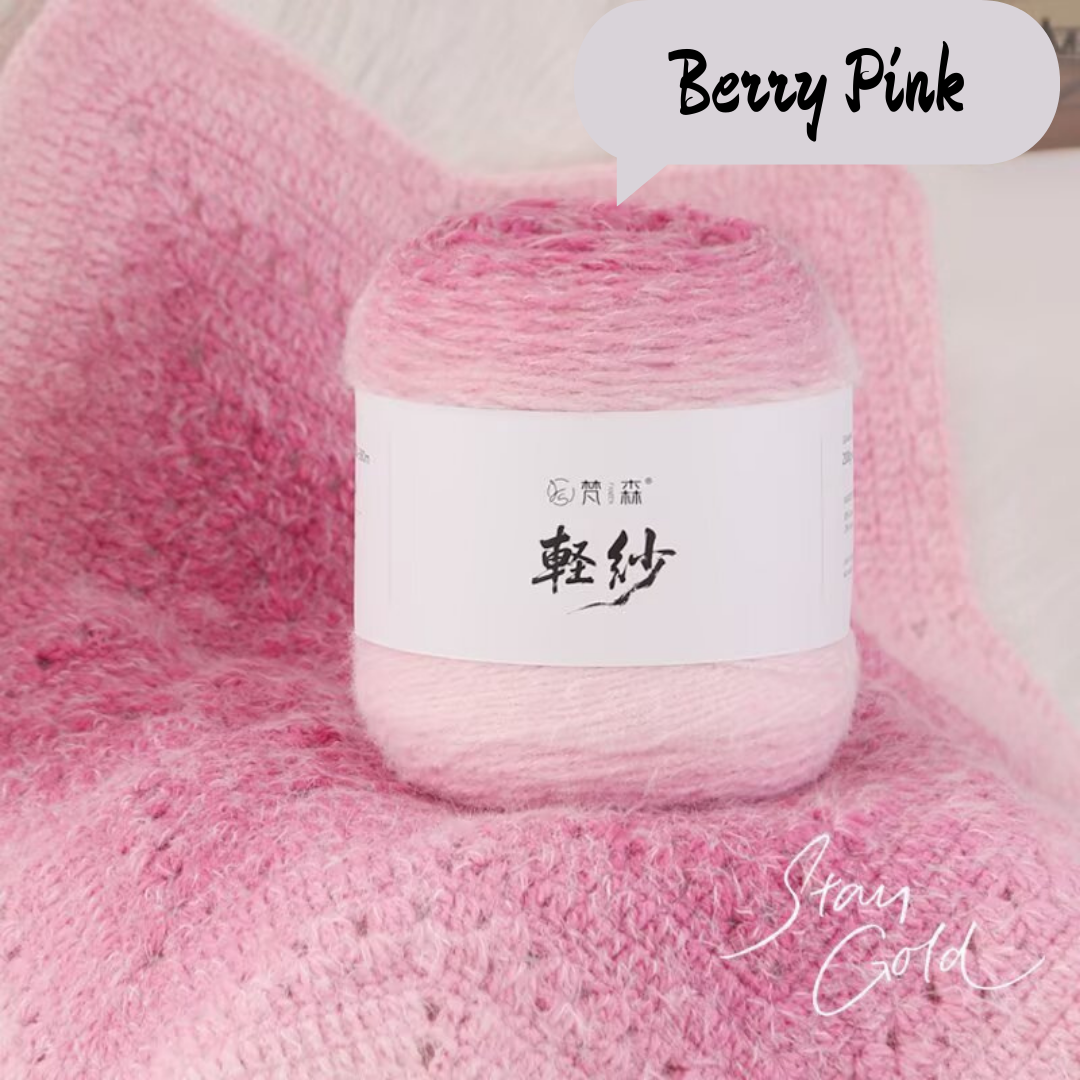Ball of yarn with a label on a pink textured background