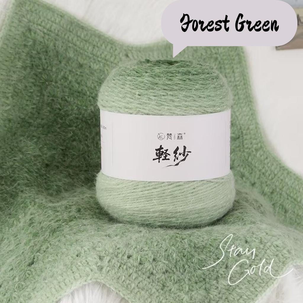 Ball of green yarn with a label on a textured green background