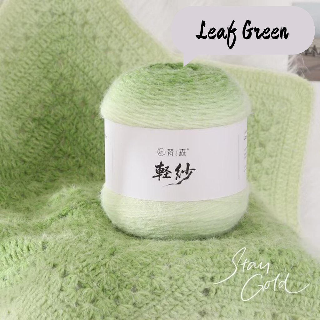 Green yarn ball with a label on a green textured background