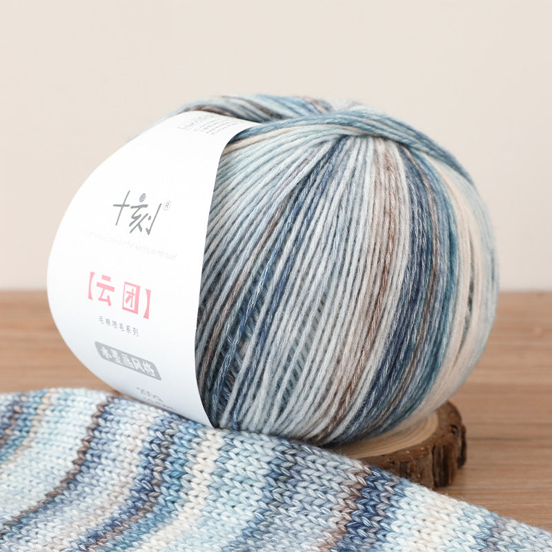 Ball of yarn with a patterned design on a wooden surface