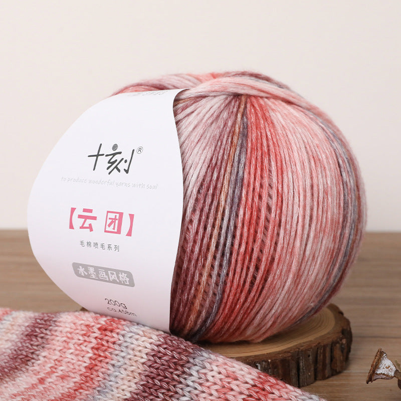 Multicolored yarn ball with a label on a wooden surface