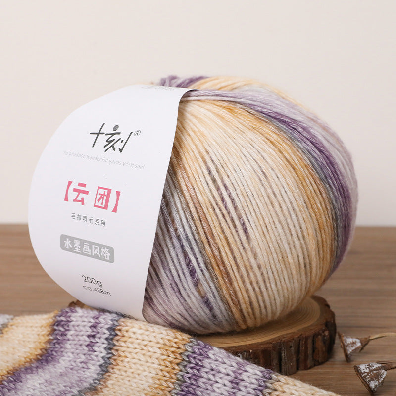 Multicolored yarn ball with a label on a wooden surface