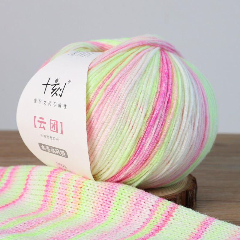 Ball of colorful yarn with a label on a wooden surface