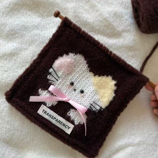 Handmade crochet cat pattern scarf kit with bronze yarn, knitting needles and cute kitten design, beginner-friendly crochet kit for cosy winter accessories