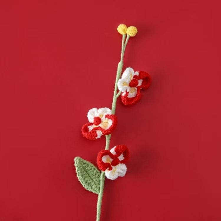 Handcrafted crochet Phalaenopsis orchid flower stem in red and white, perfect for elegant home décor or a thoughtful handmade gift for her – UK eco-friendly floral craft.