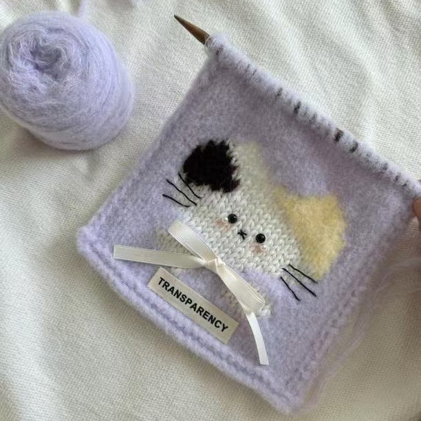 Handmade crochet cat pattern scarf kit with purple yarn, knitting needles and cute kitten design, beginner-friendly crochet kit for cosy winter accessories