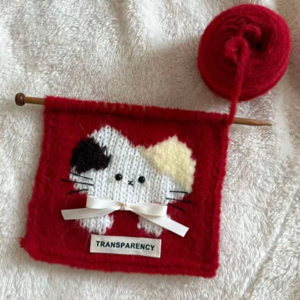 Handmade crochet cat pattern scarf kit with red yarn, knitting needles and cute kitten design, beginner-friendly crochet kit for cosy winter accessories