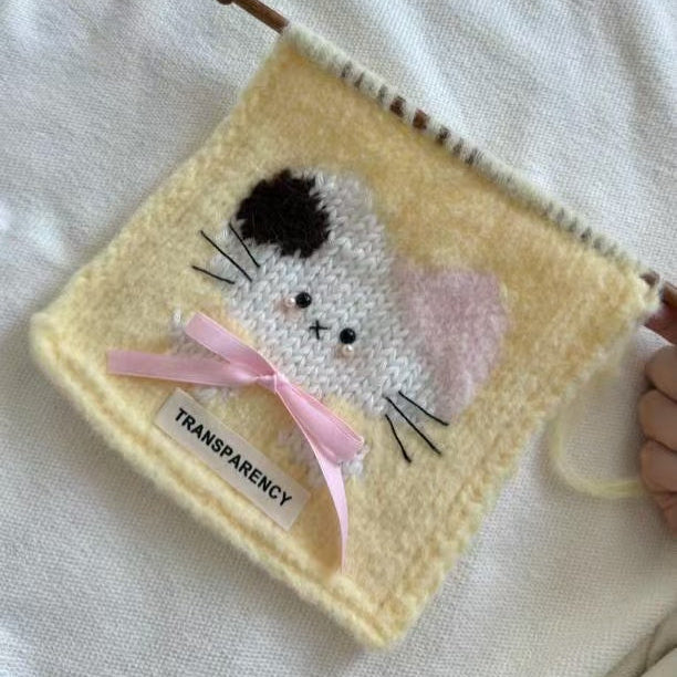 Handmade crochet cat pattern scarf kit with yellow yarn, knitting needles and cute kitten design, beginner-friendly crochet kit for cosy winter accessories