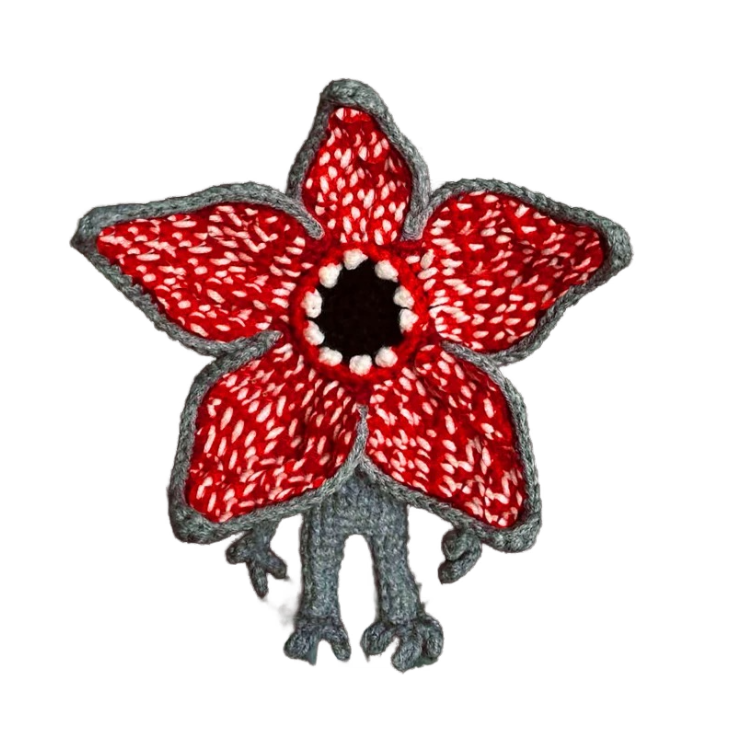 Hand-crocheted Demogorgon plush toy posed in spooky jungle scene – Stranger Things inspired UK handmade gift for collectors and fans