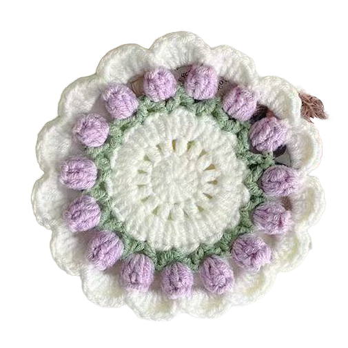 Crocheted coaster with white center and purple tulip