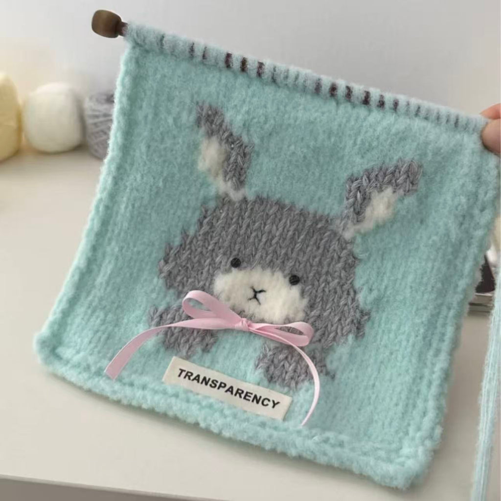 Handmade knitting cat pattern scarf kit with mint green yarn, knitting needles and cute kitten design, beginner-friendly knitting kit for cosy winter accessories