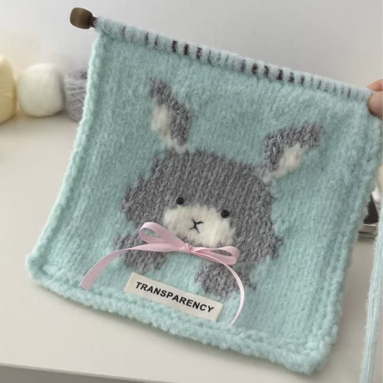 Handmade knitting cat pattern scarf kit with mint green yarn, knitting needles and cute kitten design, beginner-friendly knitting kit for cosy winter accessories