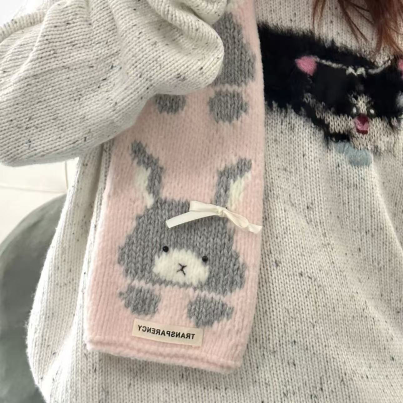 Handmade knitting cat pattern scarf kit with pink yarn, knitting needles and cute kitten design, beginner-friendly knitting kit for cosy winter accessories