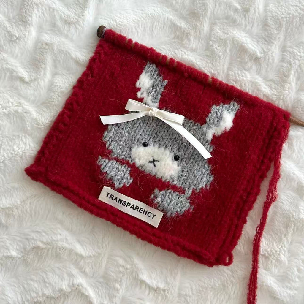 Handmade knitting cat pattern scarf kit with red yarn, knitting needles and cute kitten design, beginner-friendly knitting kit for cosy winter accessories