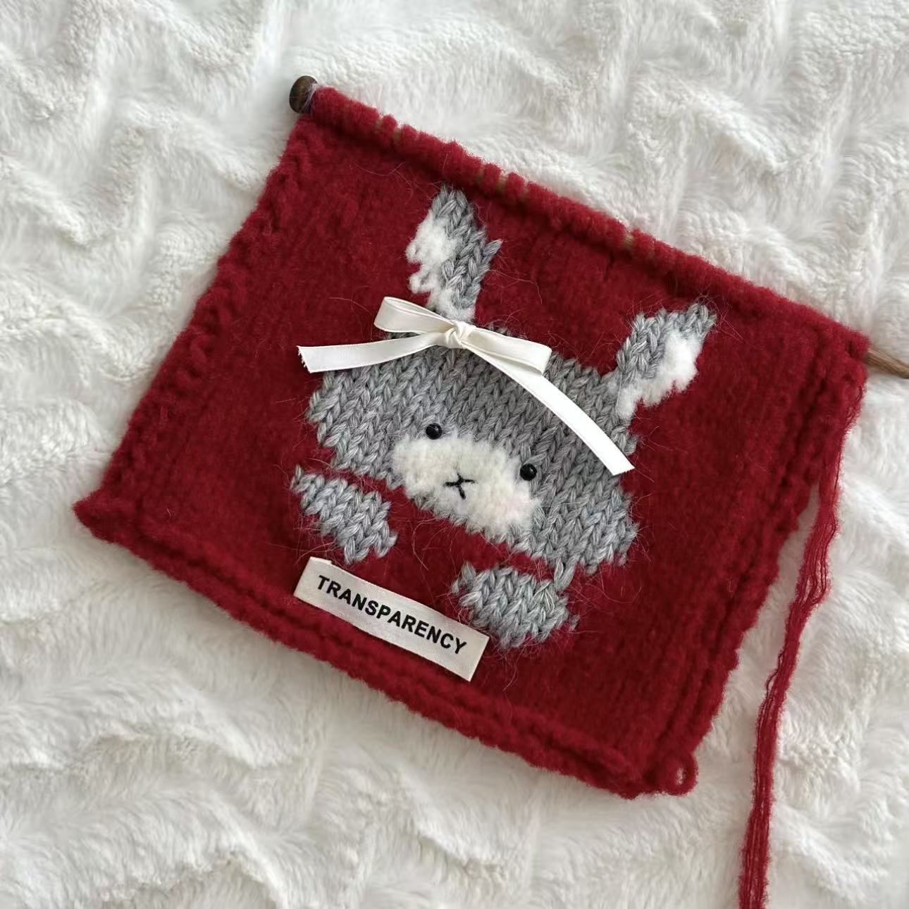 Handmade knitting cat pattern scarf kit with red yarn, knitting needles and cute kitten design, beginner-friendly knitting kit for cosy winter accessories