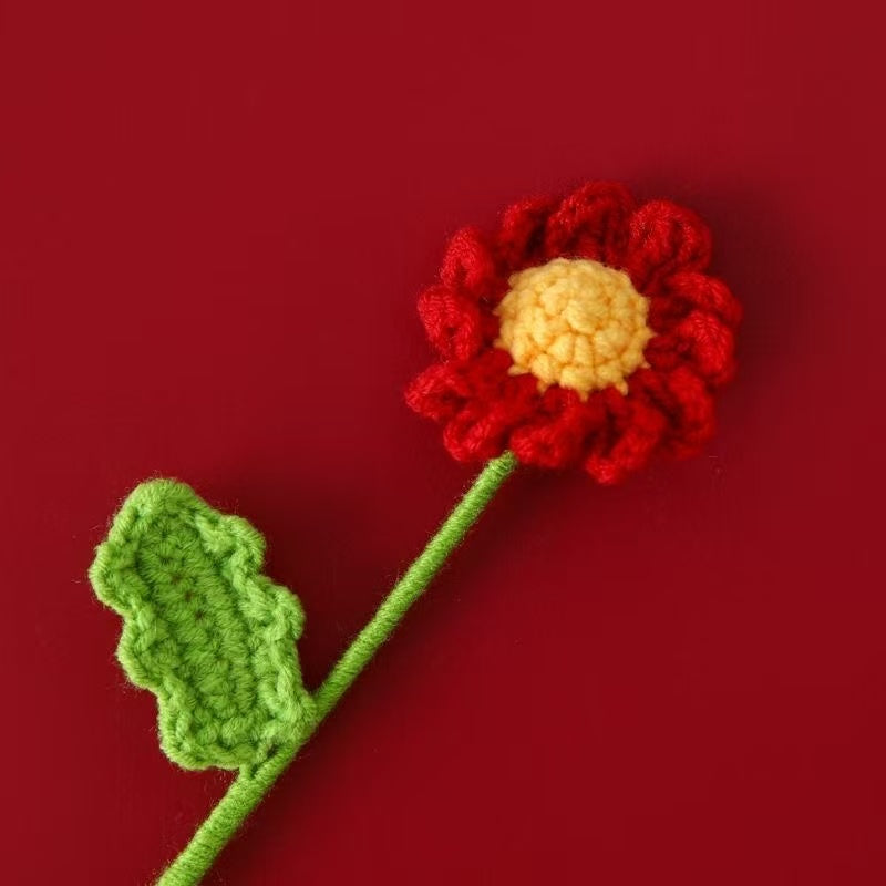 Red crochet daisy flower with yellow centre and green stem – handmade floral gift for home décor, weddings, or sustainable gifting in the UK